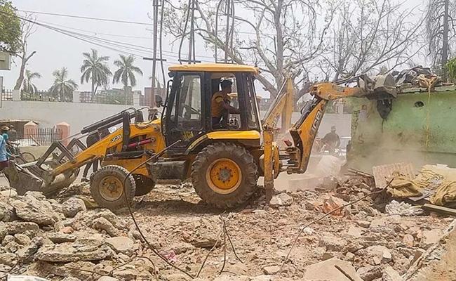Portion of allegedly illegal structure demolished in MP village