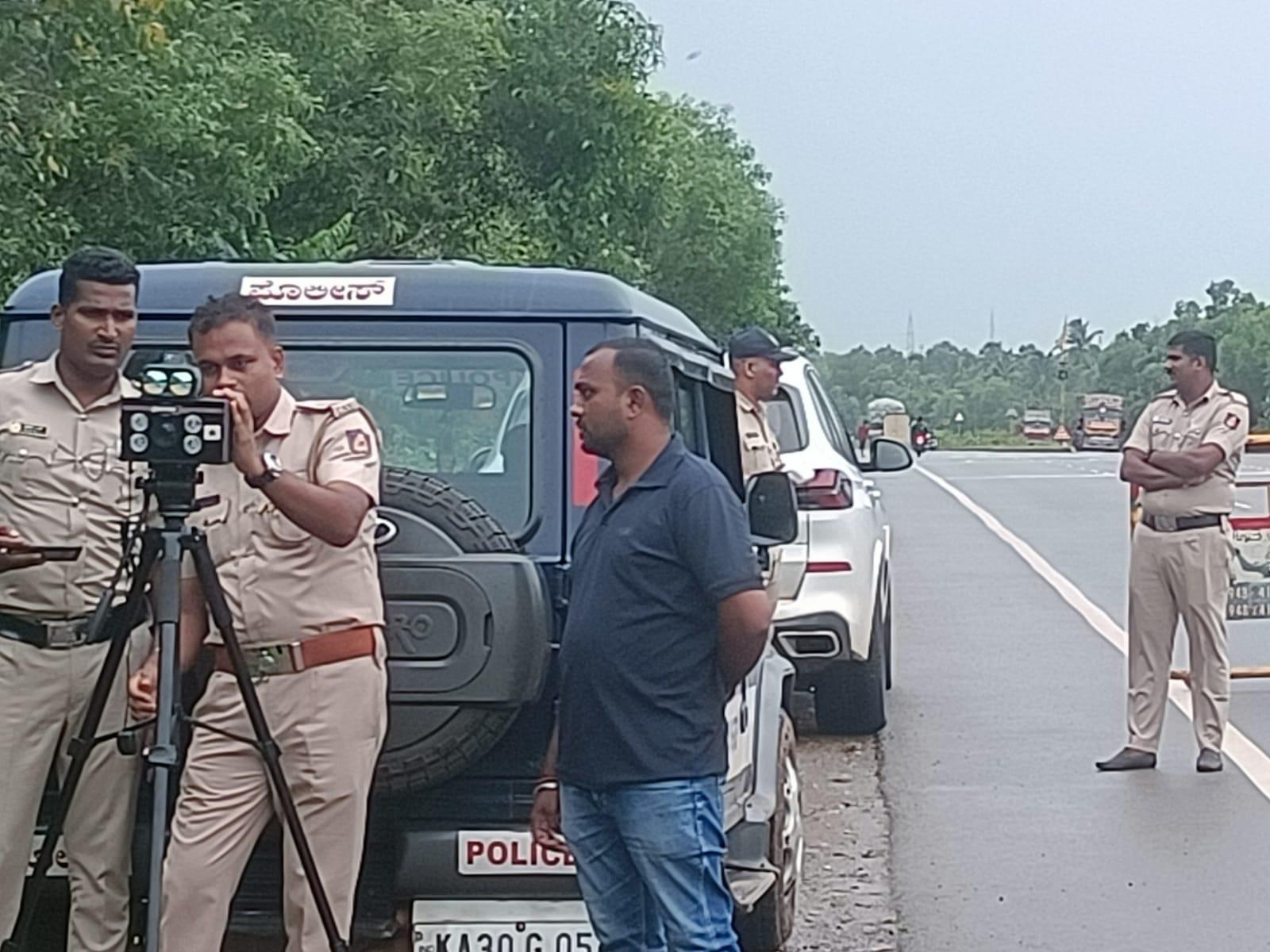 Police conduct speed enforcement drive on NH-66 in Murdeshwar using radar gun